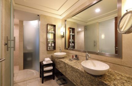 Bathroom at Mexico City Marriott Reforma Hotel. Double sinks, granite countertop, frosted glass shower. Gay-friendly hotel in Mexico City.