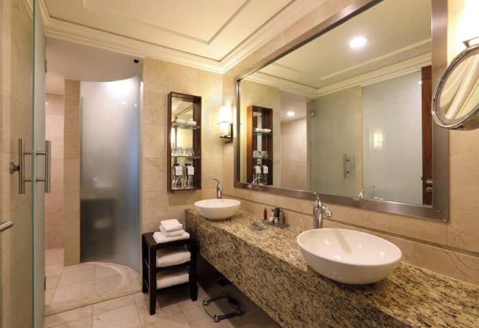Bathroom at Mexico City Marriott Reforma Hotel. Double sinks, granite countertop, frosted glass shower. Gay-friendly hotel in Mexico City.