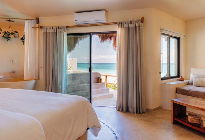 Mezzanine a Colibri Boutique Hotel Adults Only gay-friendly hotel room. Ocean view, bed, and minimalist decor. Ideal for gay travel.
