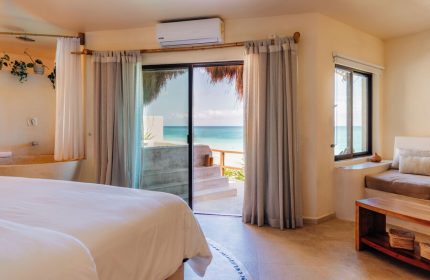 Mezzanine a Colibri Boutique Hotel Adults Only gay-friendly hotel room. Ocean view, bed, and minimalist decor. Ideal for gay travel.