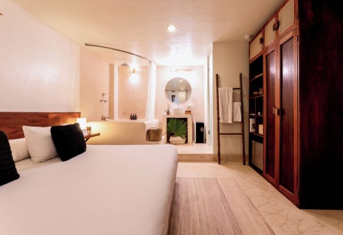Mezzanine a Colibri Boutique Hotel-Adults Only room. Gay-friendly hotel with bed, bathroom, and closet. Ideal for gay travel.