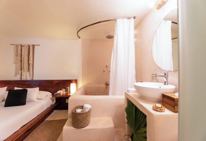 Mezzanine a Colibri Boutique Hotel-Adults Only room. Gay-friendly hotel with bed, bathtub, and sink. Ideal for gay travel and vacations.