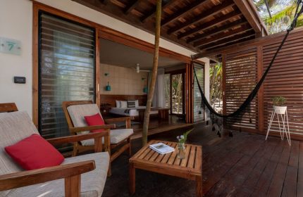 Mi Amor a Colibri Boutique Hotel Adults Only: Gay-friendly hotel room's deck with hammock, chairs, and view to the bedroom. Relaxing gay travel.