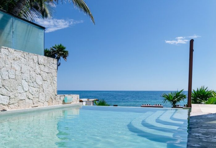 Pool view at gay-friendly Mi Amor a Colibri Boutique Hotel-Adults Only. Oceanfront luxury for gay travelers. Tropical paradise.