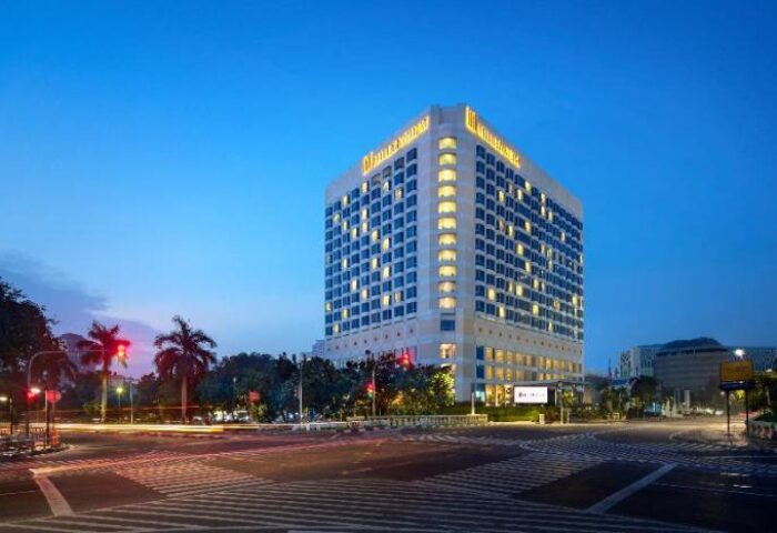 Millennium Hotel Sirih Jakarta exterior at dusk. Gay-friendly hotel in Jakarta, Indonesia, offering a welcoming experience for LGBTQ+ travelers.
