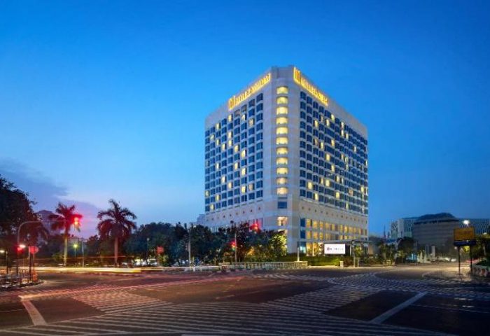 Millennium Hotel Sirih Jakarta exterior at dusk. Gay-friendly hotel in Jakarta, Indonesia, offering a welcoming experience for LGBTQ+ travelers.