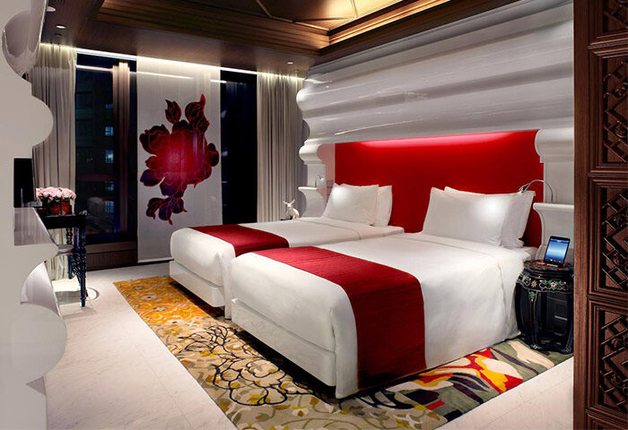 Mira Moon Hotel: Gay-friendly twin room with red accents, stylish decor, and modern amenities. Ideal for gay men's travel in Hong Kong.