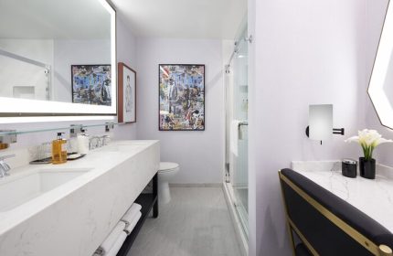 Bathroom at the Montrose at Beverly Hills, a gay-friendly hotel. Double sink, marble countertop, shower, and modern decor for gay travelers.