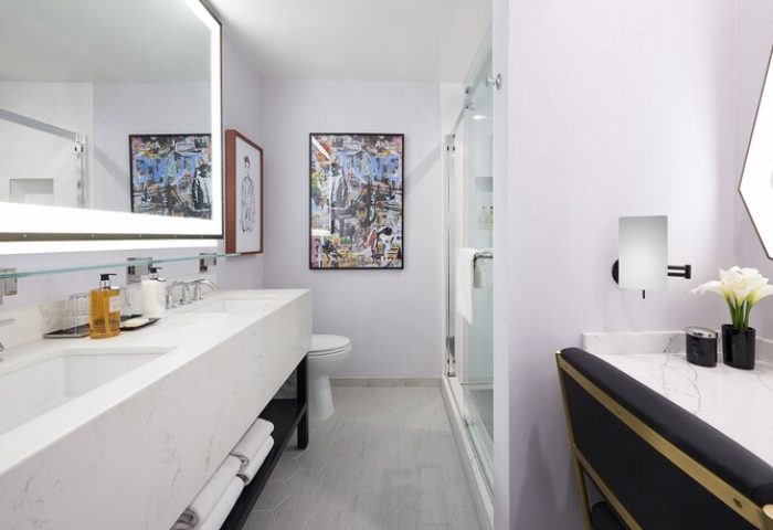 Bathroom at the Montrose at Beverly Hills, a gay-friendly hotel. Double sink, marble countertop, shower, and modern decor for gay travelers.