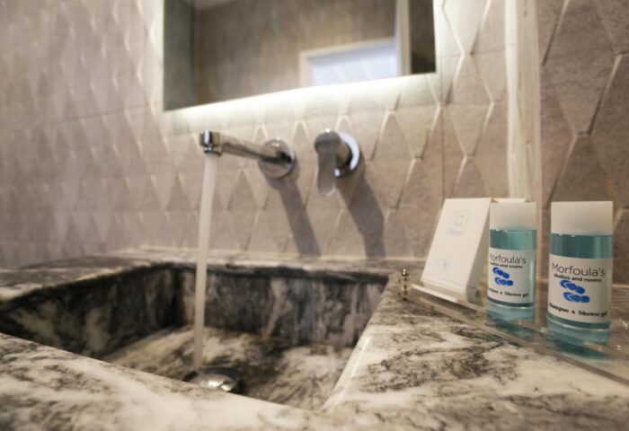 Morfoula's Studios bathroom sink. Gay-friendly hotel with modern amenities. Shampoo and shower gel provided. Ideal for gay men travel.
