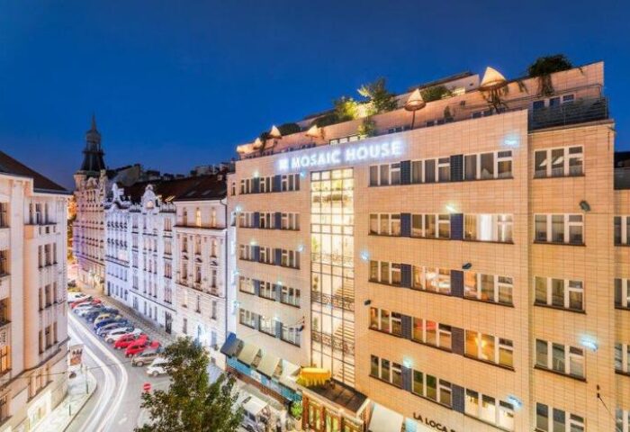 Mosaic House Design Hotel exterior at night. Gay-friendly hotel in Prague, Czech Republic. Modern design with rooftop terrace.