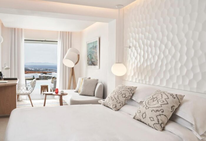 Myconian Kyma Design Hotel's gay-friendly room. Bright, modern interior with sea view. Luxury travel for gay men in Mykonos.
