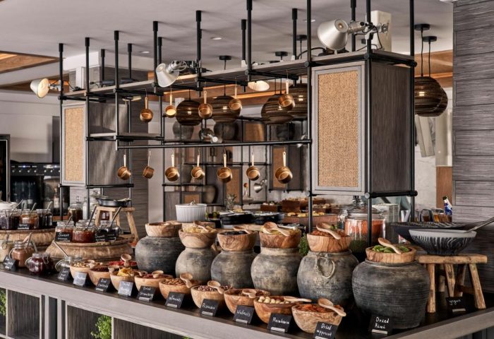 Myconian Kyma Design Hotel's breakfast buffet. Gay-friendly hotel with jams, nuts, and dried fruits. Luxury travel in Mykonos.