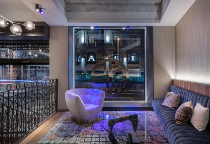 NH Collection Madrid Gran Via hotel lounge area. Gay-friendly, pet-friendly hotel with stylish decor, comfortable seating, and city views.