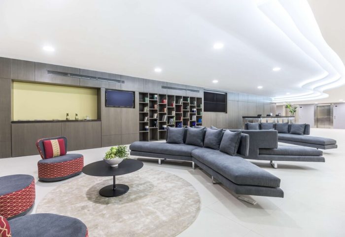 NH Collection Mexico City Reforma's stylish lounge area. Gay-friendly hotel with modern decor, comfortable seating, and a welcoming atmosphere.