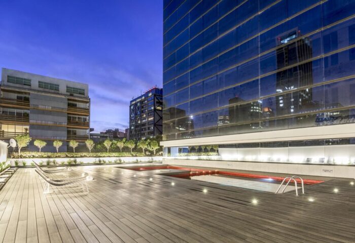 Rooftop pool at the gay-friendly NH Collection Mexico City Reforma hotel. Modern design, wooden deck, city views. Ideal for gay travel.
