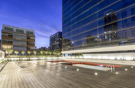 Rooftop pool at the gay-friendly NH Collection Mexico City Reforma hotel. Modern design, wooden deck, city views. Ideal for gay travel.