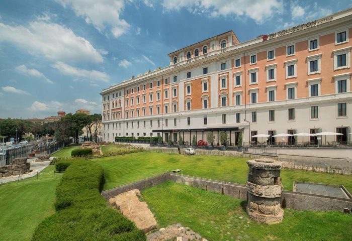 NH Collection Palazzo Cinquecento, a gay-friendly hotel in Rome. Exterior view with garden, ruins, and hotel facade. Great location for gay travel.