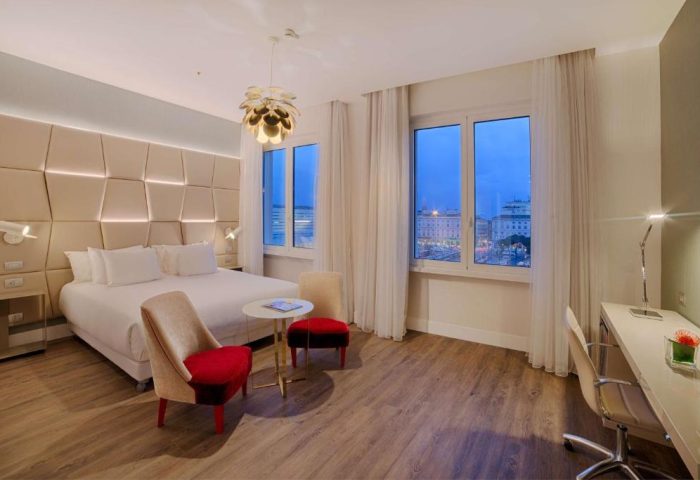 NH Collection Palazzo Cinquecento gay-friendly hotel room. Modern design, large windows, desk, and bed. A great choice for gay men travelers.