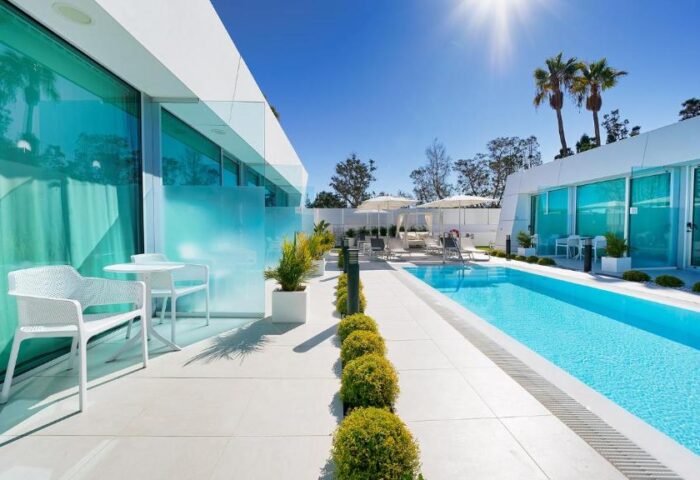 Hotel Nayra Adults Only: A gay-friendly hotel with a pool, sun loungers, and modern architecture. Perfect for gay men's travel in Gran Canaria.