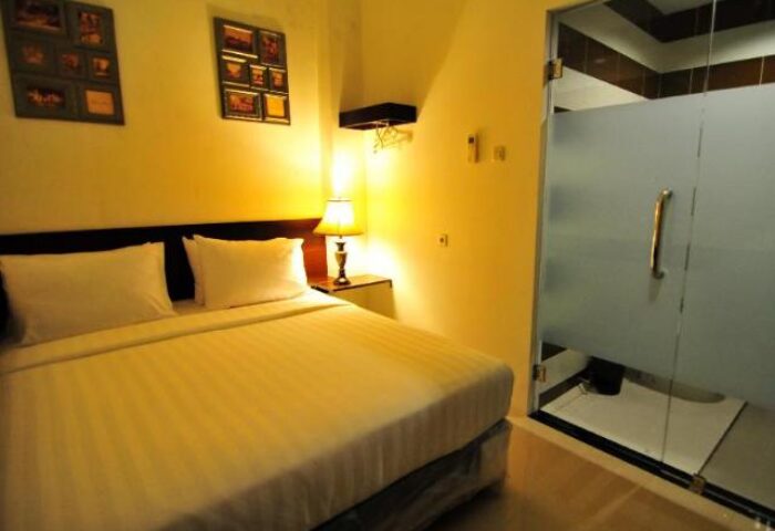 New Batavia Capsule Hotel room with bed and bathroom. Gay-friendly hotel with modern amenities for gay travelers. Capsule hotel room interior.