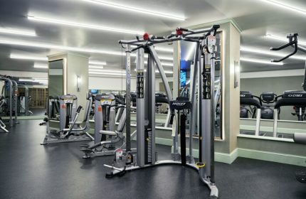Gym at NoMad Las Vegas, a gay-friendly hotel. Hoist cable machine and Cybex treadmills for a workout. Fitness center for gay travelers.