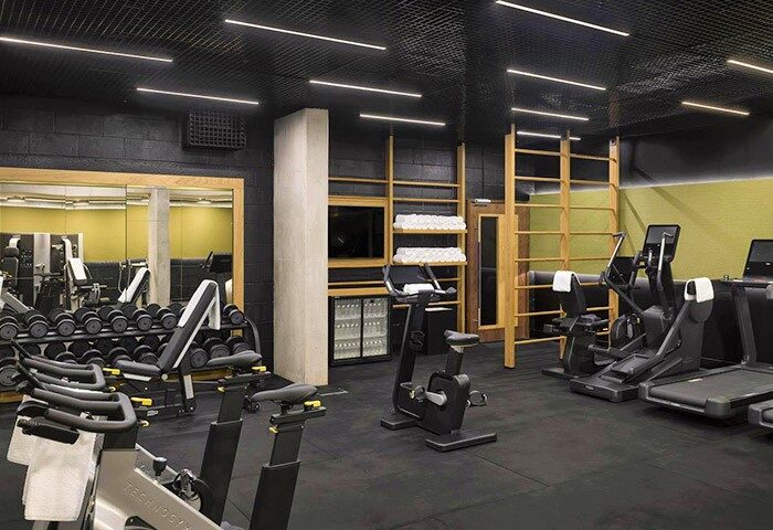 Nobu Hotel Shoreditch gym. Gay-friendly, pet-friendly hotel with weights, treadmills, and exercise bikes. Sleek, modern design.