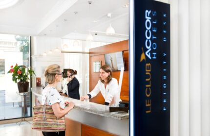 Novotel Budapest Centrum Hotel reception desk. Staff helping a guest. Gay-friendly hotel in Budapest, Hungary for gay men's travel advice.
