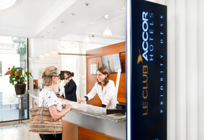 Novotel Budapest Centrum Hotel reception desk. Staff helping a guest. Gay-friendly hotel in Budapest, Hungary for gay men's travel advice.