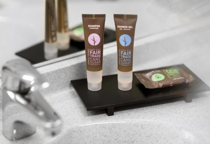 Bathroom amenities at Novotel Budapest Centrum Hotel, a gay-friendly hotel. Shampoo, shower gel, and soap made with fair trade cane sugar.