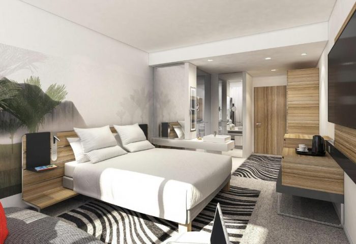 Novotel London Waterloo Hotel bedroom. Gay-friendly hotel room with double bed, modern design, and ensuite bathroom. Ideal for gay travel.