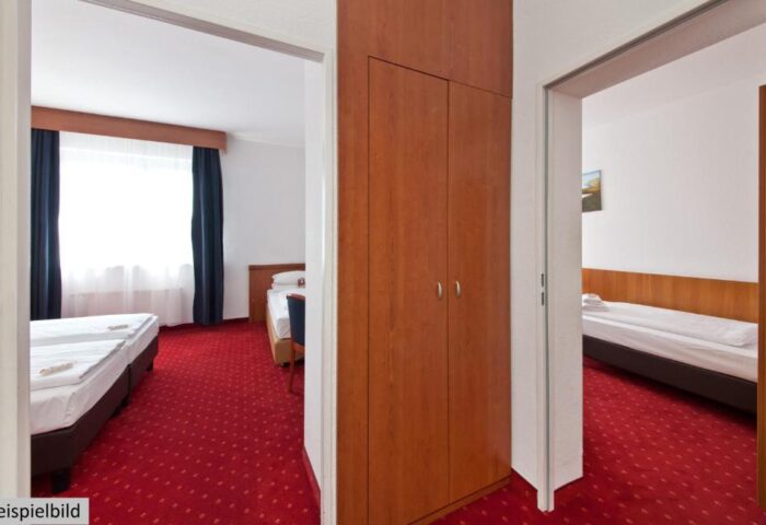 Novum Hotel Aldea Berlin Zentrum room. Gay-friendly hotel with red carpet, closet, and beds. Comfortable stay in Berlin.