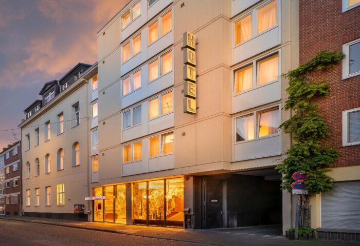 Novum Hotel Leonet Köln Altstadt exterior. Gay-friendly hotel in Cologne's old town. Facade view with HOTEL sign. Travel destination.