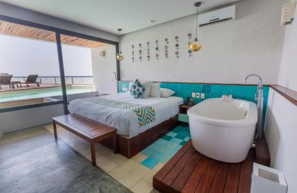 O' Tulum Boutique Hotel Adults Only room. King bed, bathtub, and pool view. Gay-friendly hotel in Tulum, Mexico for gay men's travel.