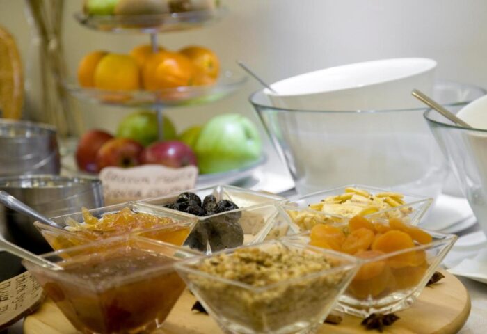 Breakfast bar at O&B Athens Boutique Hotel. Gay-friendly hotel offers fruit, jams, nuts, and yogurt. Perfect for gay travelers in Athens.