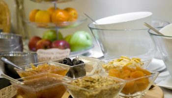 Breakfast bar at O&B Athens Boutique Hotel. Gay-friendly hotel offers fruit, jams, nuts, and yogurt. Perfect for gay travelers in Athens.