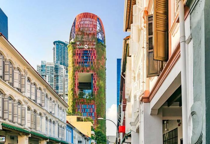 Oasia Hotel Downtown Singapore by Far East Hospitality. Gay-friendly hotel view from the street. Unique architecture with greenery.