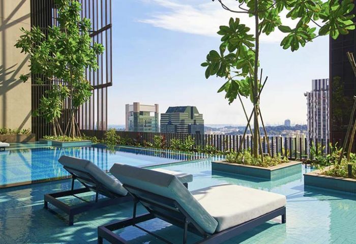Oasia Hotel Downtown Singapore pool. Gay-friendly hotel rooftop pool with lounge chairs and city view. Far East Hospitality hotel.