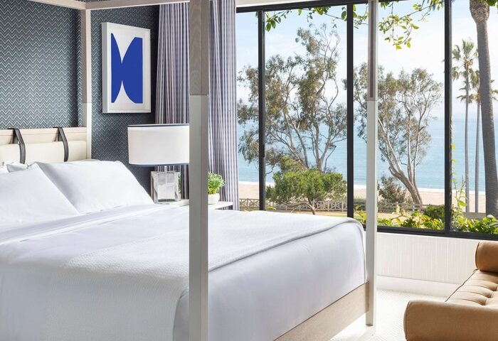 Gay-friendly Oceana Santa Monica LXR Hotels & Resorts room view. Canopy bed, ocean view, modern design. Ideal for gay travel, Santa Monica.