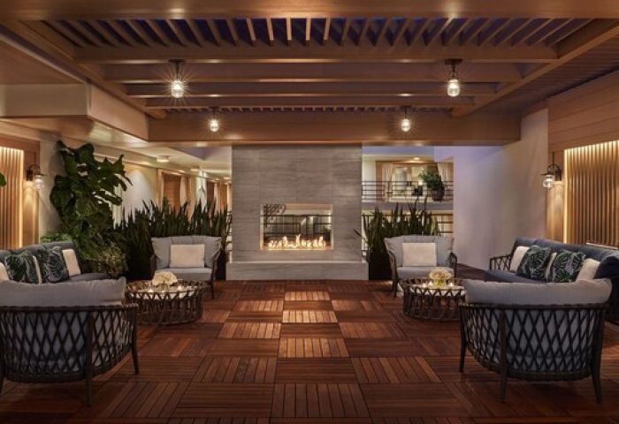 Oceana Santa Monica LXR Hotels & Resorts gay-friendly hotel lounge area. Fireplace, seating, bar. Luxury travel for gay men in Santa Monica.