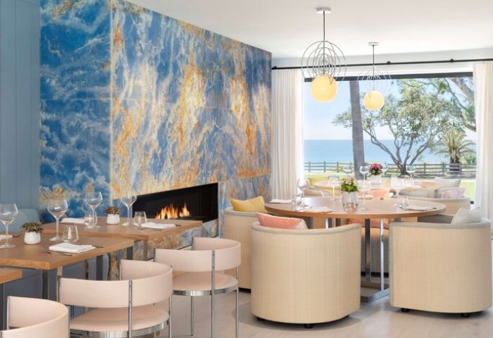 Oceana Santa Monica, LXR Hotels & Resorts dining room. Gay-friendly hotel with ocean views, fireplace, modern lighting, and stylish seating.