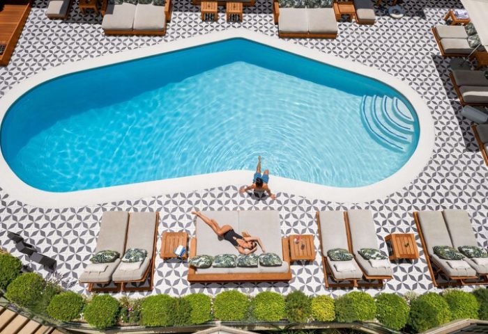 Oceana Santa Monica LXR Hotels & Resorts pool view. Gay-friendly hotel with luxury loungers, swim, and sun. Perfect for LGBTQ+ travelers.