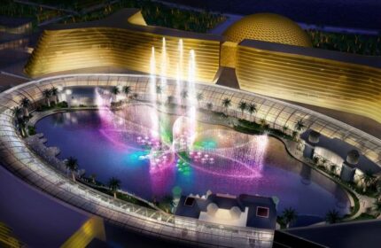 Okada Manila's gay-friendly hotel: Aerial view of the hotel's fountain show at night. A luxurious travel destination for gay men in Manila.