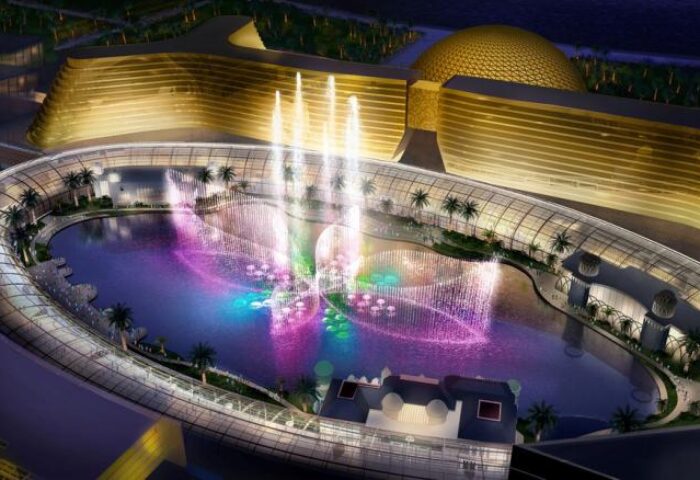 Okada Manila's gay-friendly hotel: Aerial view of the hotel's fountain show at night. A luxurious travel destination for gay men in Manila.