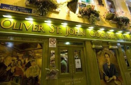 Oliver St. John Gogarty's Hostel exterior. A gay-friendly hotel in Dublin, Ireland, with a traditional Irish pub facade and flower boxes.