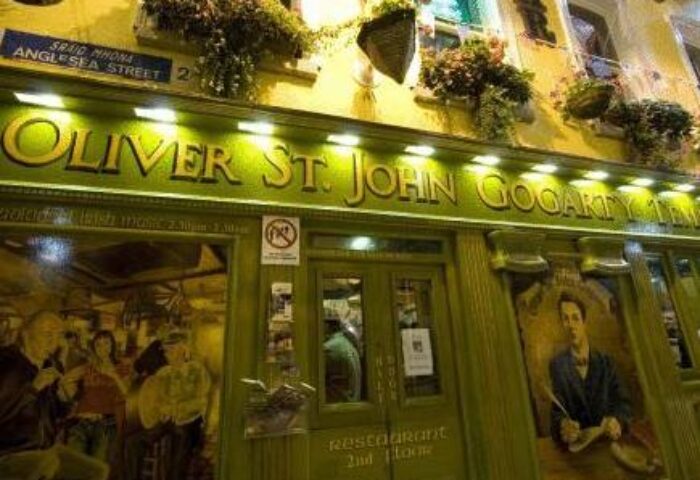 Oliver St. John Gogarty's Hostel exterior. A gay-friendly hotel in Dublin, Ireland, with a traditional Irish pub facade and flower boxes.