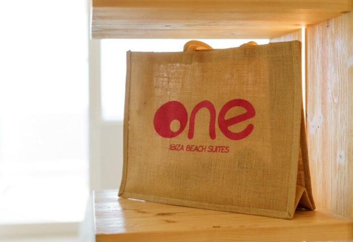 One Ibiza Suites' tote bag. Gay-friendly hotel offers stylish jute bags for guests. Perfect for carrying essentials to Ibiza's beaches.