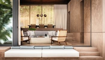 One&Only Mandarina's gay-friendly hotel suite. Modern design with a neutral color palette, plush seating, and open-air living space. Luxury travel.