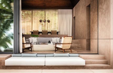 One&Only Mandarina's gay-friendly hotel suite. Modern design with a neutral color palette, plush seating, and open-air living space. Luxury travel.
