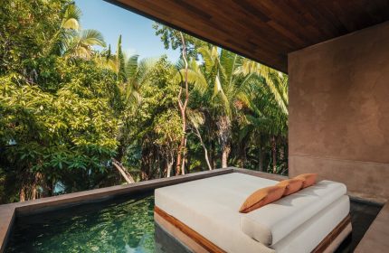 One&Only Mandarina gay-friendly hotel suite. Daybed by a plunge pool overlooking lush jungle. Luxury gay travel in Riviera Nayarit, Mexico.